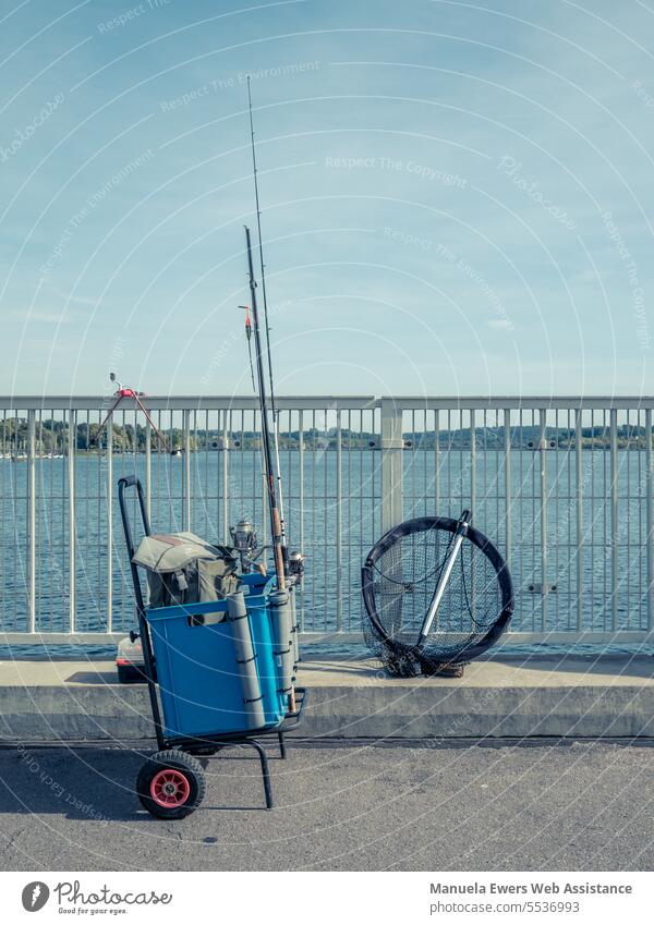 Anglers have set up their equipment on a pier. - a Royalty Free Stock Photo  from Photocase