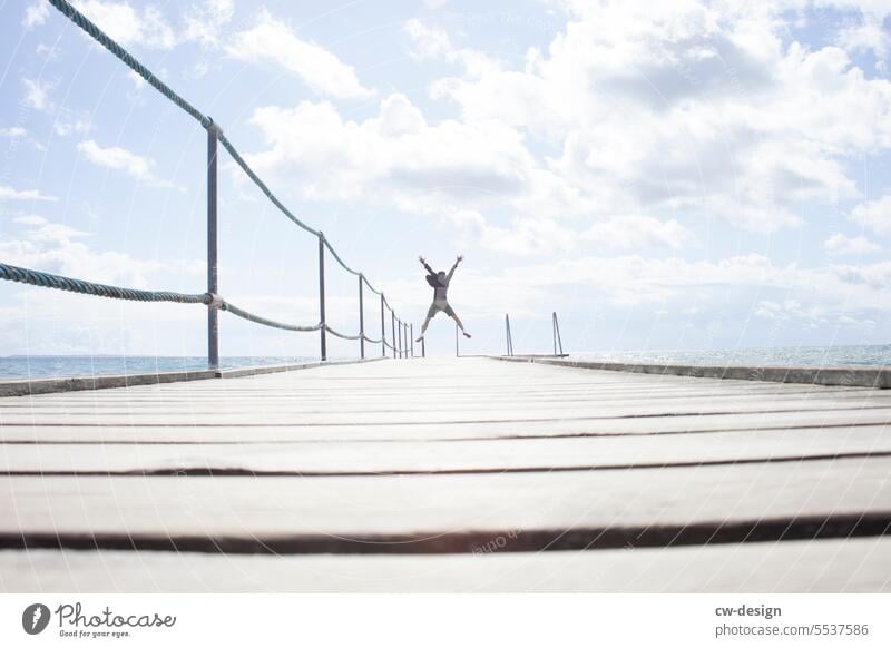 Jetty with person in Denmark Jump Footbridge Man Blue