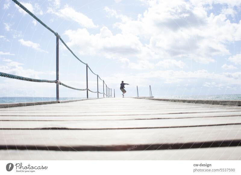 Jetty with person in Denmark Footbridge Water Summer Movement