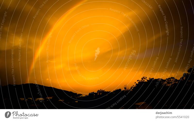 A rainbow over the mountain hill with sunset. Rainbow Light Prismatic colour Prismatic colors Colour Multicoloured Deserted variegated Beam of light Spectral