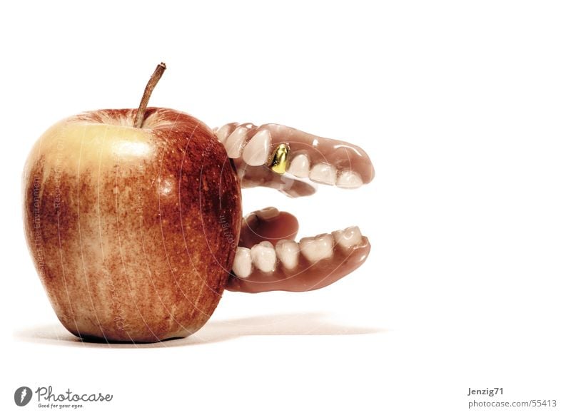 Bite hard. Gold tooth Prothesis Dental implant Adhesive cream Apple Fruit Nutrition Teeth