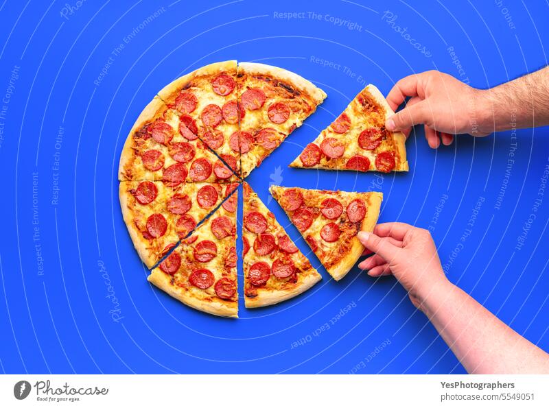 Homemade pizza with pepperoni, minimalist on a blue table above background baked bright chart cheese color colorful comfort crust cuisine delicious dinner