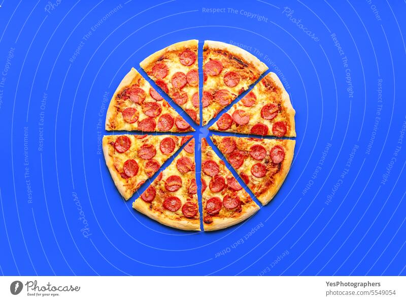 Sliced pepperoni pizza minimalist on a blue table above background baked bright chart cheese color colorful comfort crust cuisine delicious dinner eating fast