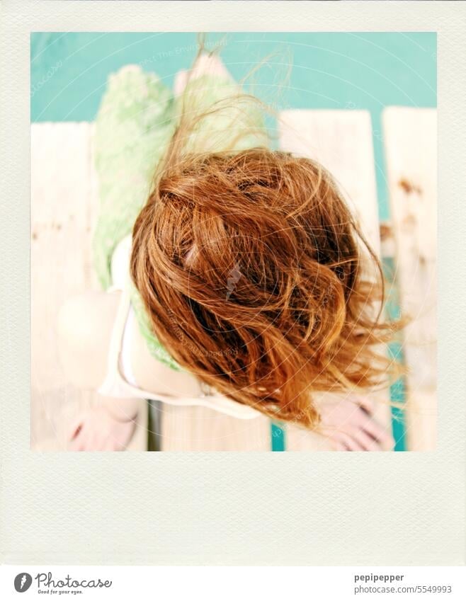 Polaroid - bird's eye view, red haired woman sitting relaxed on a wooden walkway Red-haired Redheads redhead Woman long hairs long dress Beach life Long-haired