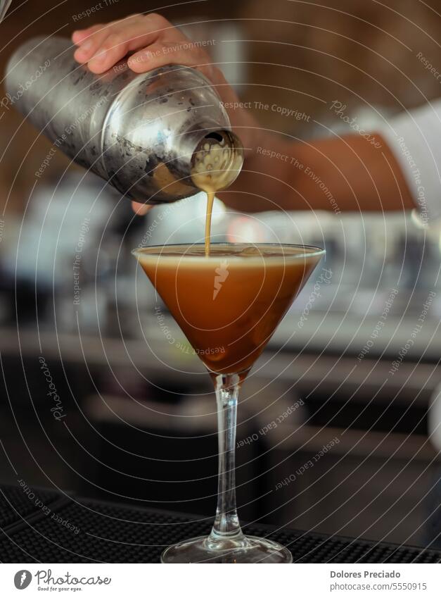 Espresso martini cocktail that is drunk cold and made with espresso coffee, coffee liqueur and vodka alcohol alcoholic alcoholic drinks bar bar counter beverage