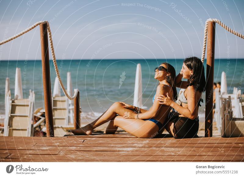 Beautiful women enjoying vacation on the beach