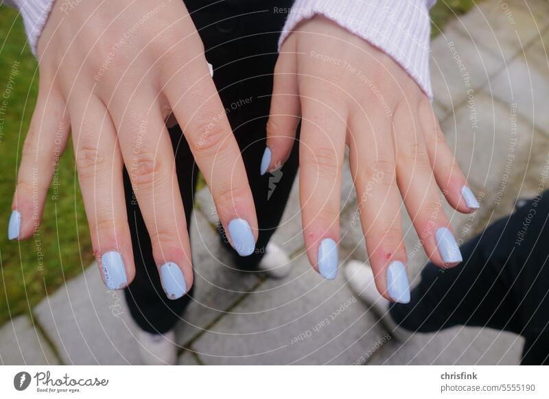 Girl hands with fingernails painted blue Hand Nail polish Blue light blue Woman Beauty & Beauty Fingers Fingernail Cosmetics Close-up care Medical treatment