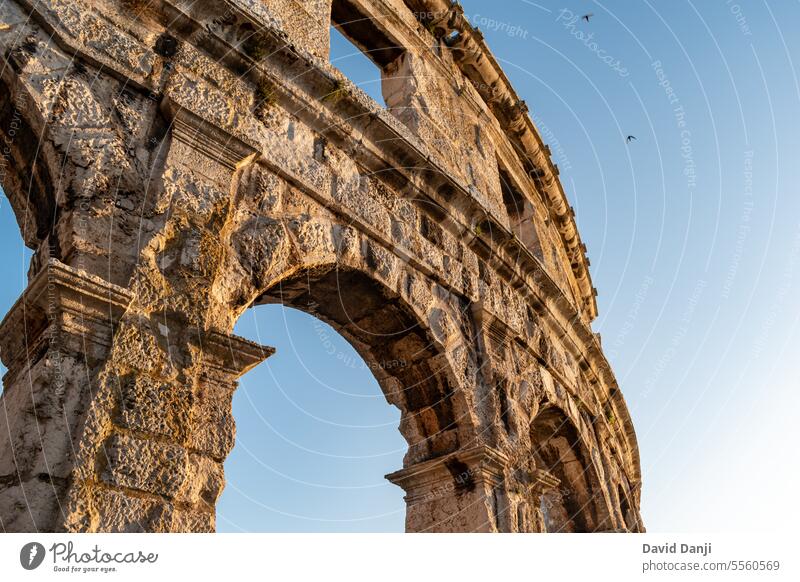 Pula Arena is a Roman amphitheatre located in Pula, Croatia. This photo is taken in July, 2023. adriatic amphitheater ancient antique arch archaeology