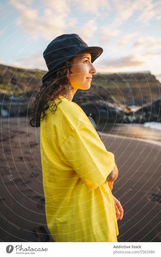 Pensive woman on beach sea pensive seashore ocean thoughtful calm coast happy female sand wave nature long hair smile wind water Tenerife Canary Islands seaside