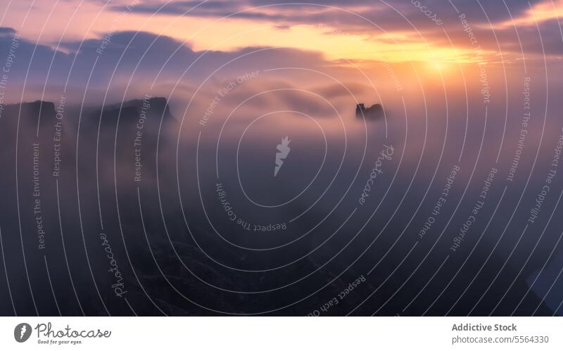 Ruins on mountain peak above clouds on foggy day sky ruin cloudy nature landscape gloomy picturesque dramatic sundown environment sunset barrancas de burujon