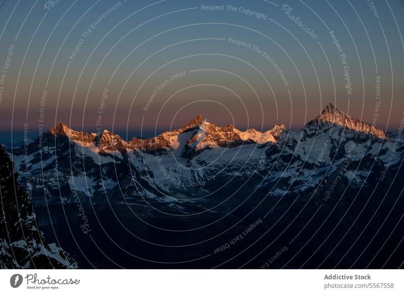 Mountain and landscape covered with snow against sky picturesque view mountain range rock covering cloudy swiss alps peak top winter natural high alpine