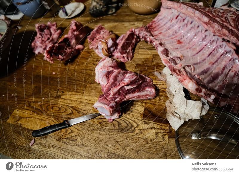 raw pork meat on kitchen table. background black board butcher butchery chop closeup cooking cuisine cut dinner fat fillet food fresh grill ingredient market