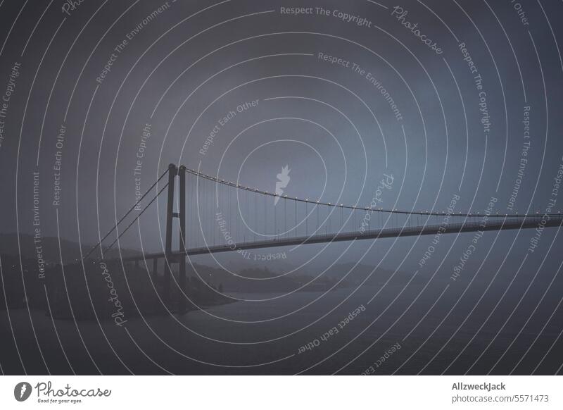 Askøy Bridge in Norway at night in fog and rain Suspension bridge Night Night sky hazy hazy weather foggy Rain Drizzle Comfortless Cold Wet Dark Colorless