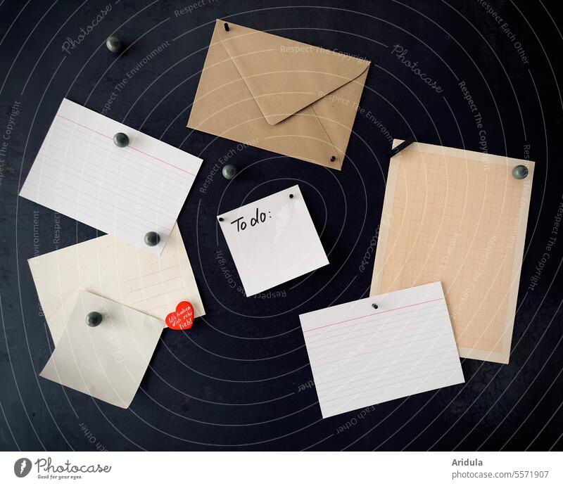 Various pieces of paper and an envelope on a black magnetic board Memo Msgnet wall Piece of paper Envelope (Mail) info Paper Letter (Mail) Information notes