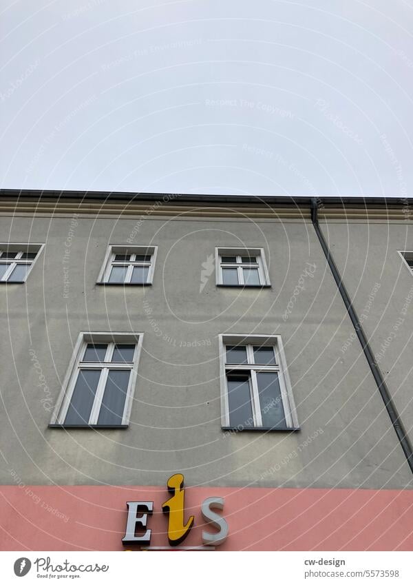 Façade with the letters E i S Ice Facade Window Gray Gloomy