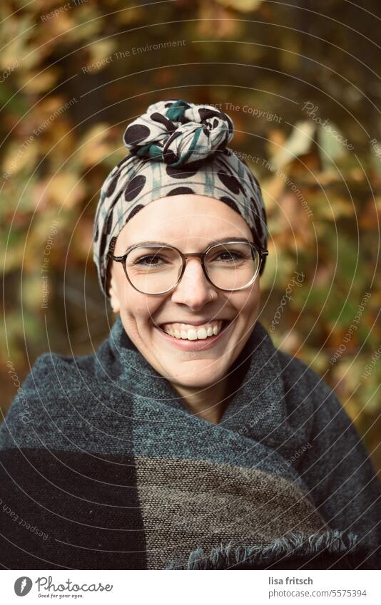 LAUGHTER - JOY - BEAUTY Woman 18 - 30 years Eyeglasses Scarf portrait Close-up Autumn coloured leaves Headwear Headscarf pretty Joy fortunate Contentment