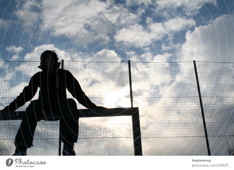 High fives & blue skies Clouds Football pitch Man Fence To enjoy Exterior shot Aachen Winter Think Relaxation Breathe Air Breathe in Infinity Sky Cozy Sit