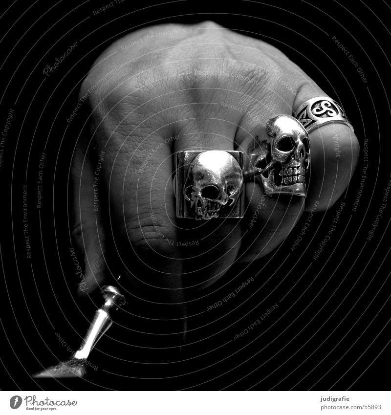 Male hand with skull rings Hand Man Fist Fork Jewellery Black White Fingers Dark Human being Nutrition Circle Death's head Silver harley Skin dark