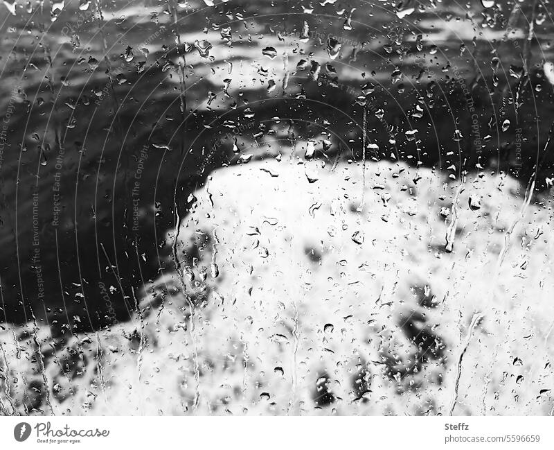 Storm and rain behind the window pane Gale Rain stormy sea North Sea Force of nature Window pane Ocean Waves Hurricane waves Storm waves stormy weather Slice