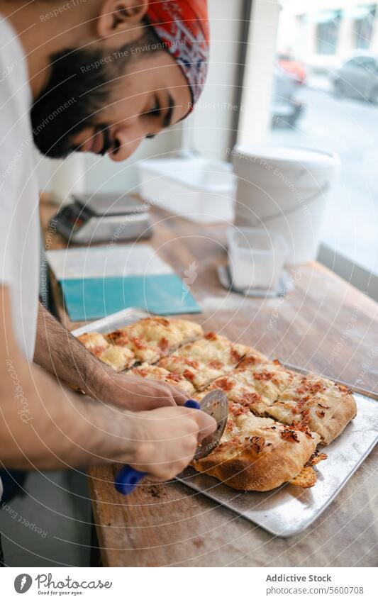 Arabic pizza maker cutting dough with cutter arabic food fresh cheese close-up hands italian restaurant dinner traditional meal delicious oven mozzarella