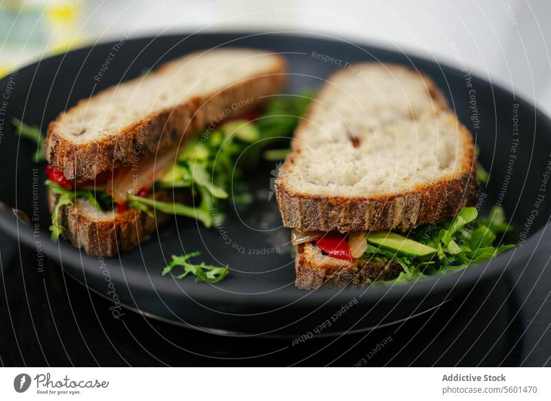 Two vegetable sandwiches in one pan vegan chef cook cooking kitchen food professional vegetables restaurant work dish bread cuisine job preparation close-up