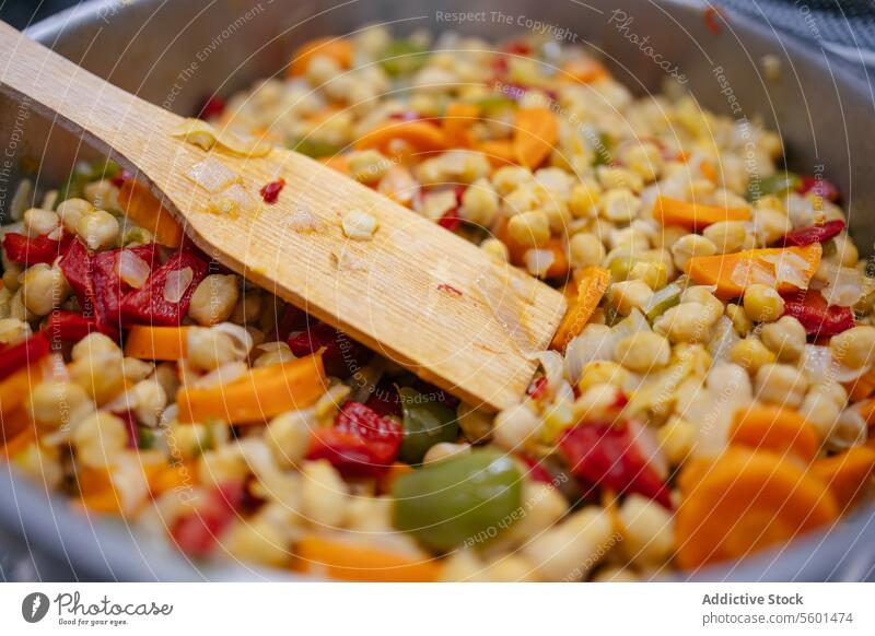 Vegetables with chickpeas in a pot chef cook cooking kitchen vegan food professional vegetables restaurant work dish cuisine job preparation close-up meal