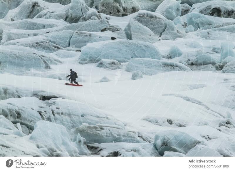 Person snowboarding on Swiss Alps during vacation man mountain rock swiss alps unrecognizable snowboarder person landscape adventure winter active ride holiday