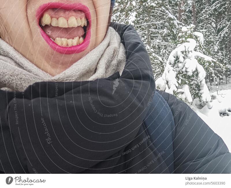 Fun photo of woman smiling with yellow crooked teeth in winter setting? Teeth Mouth Face Lips red lips Tongue Funny Laughter Skin Human being Woman Winter Snow