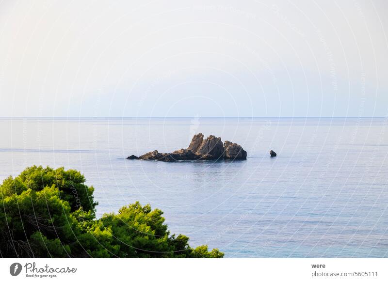 Coast and lonely rocks in the sea near Sinarades on the island of Corfu Beaches Byzantine churches Corfu Town Crystal clear waters Culture Greece Greek cuisine