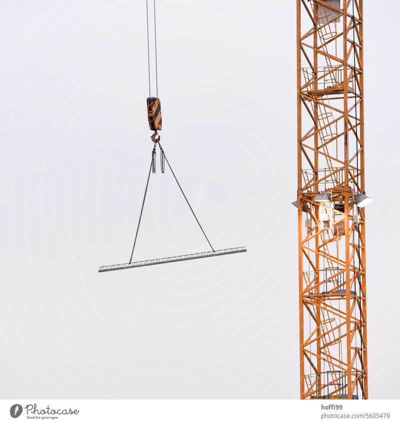 Construction site crane with concrete part on hook minimalism crane hook Crane Construction crane Sky Industry Build Workplace Work and employment Tall Economy