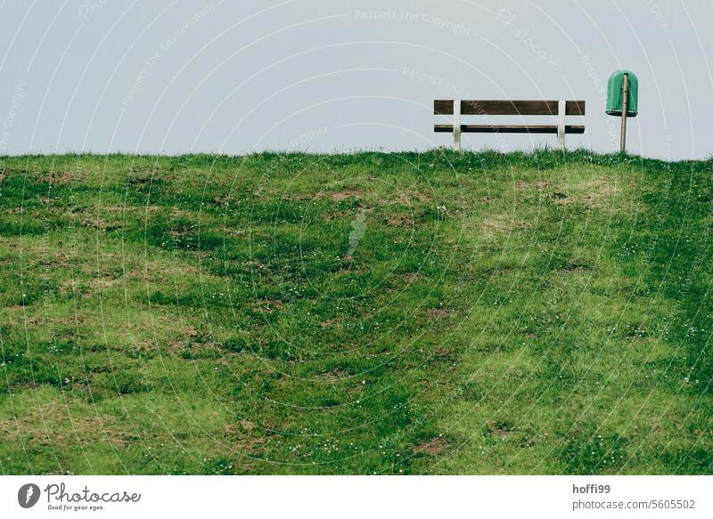 Bench and garbage can on a green embankment rubbish bin Dike Minimalistic minimalism Loneliness Calm Sky Deserted Green Nature Relaxation Park bench Sit Seating