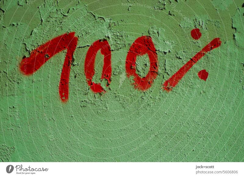 100% in red and green Digits and numbers Green Red Plaster wall Surface Surface structure Detail Handwriting Characters Handwritten Clue conspicuous Street art