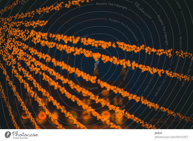 It still glitters... Christmas & Advent Town Lighting Marketplace Atmosphere Lübeck Night Christmas Fair atmospheric Moody Illuminate Evening Dark Fairy lights