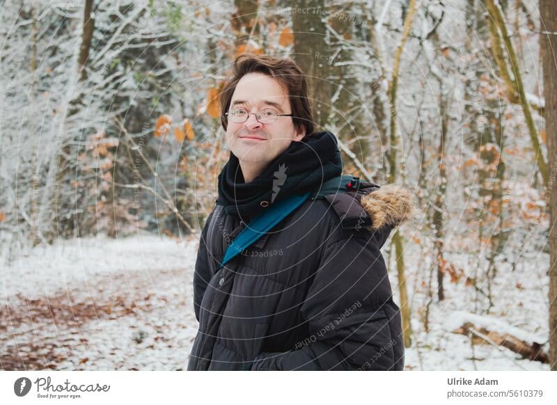 Man in the winter forest Landscape silent idyllically Winter vacation Cold Nature Snow Forest