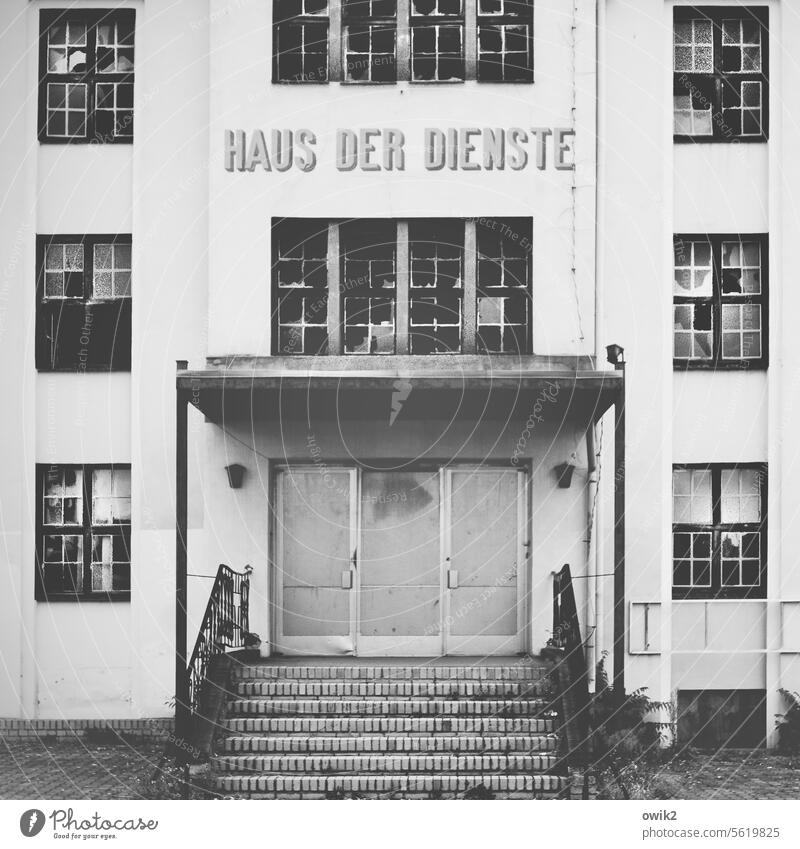 After hours Manmade structures Building Facade dilapidated GDR architecture GDR past then House of services Gloomy Deserted forsake sb./sth. abandoned Entrance