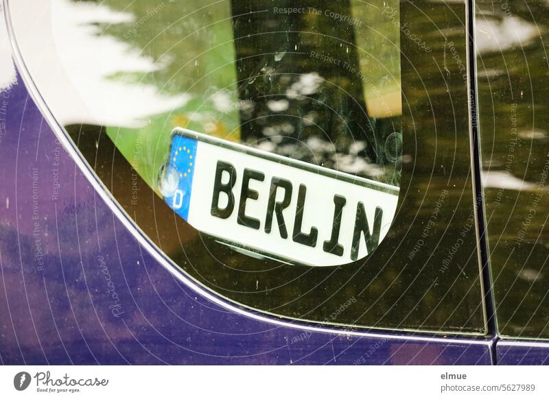 License plate - Sign with BERLIN behind a car window Berlin License plate number characteristics Motor vehicle protective screen Blog destination Capital city