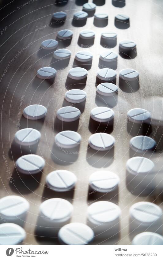Lots of white tablets, stockpile, tablet addiction Medication medicine Addiction Painkiller antibiotic drug addiction addiction to tablets Assisted death