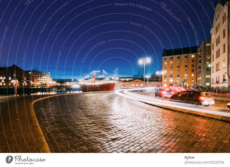 Helsinki, Finland. View Of Pohjoisranta Street In Evening Or Night Illumination. Colourful Night Starry Sky In Dark Blue Colors. Sky Glowing Stars Background. Sky Gradient