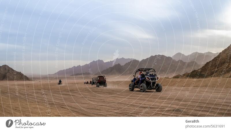 trip of tourists to the desert on the offroad buggy in Egypt Sharm El Sheikh action adventure auto background car caravan climate clouds day destination dirt