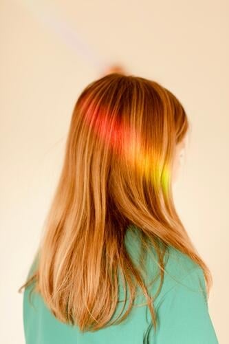 a streak of light in rainbow colors in a child's hair.hope, joy, happiness Beam of light Rainbow Child Hope Joy Happy Light Tolerant Multicoloured Refraction