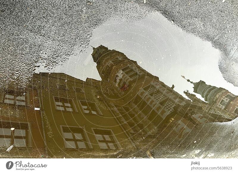 Gdansk, Poland. Reflection in a puddle Reflections Puddle Water House (Residential Structure) Sky Tower Old building city somber Dark Town reflection