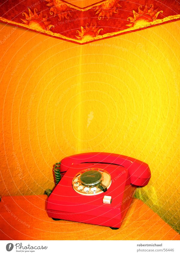 The red telephone Telephone Red Yellow Pattern Wall (building) Wallpaper Ingrain wallpaper Select Listening Lie Buttons Pushing Important Retro Seventies Style