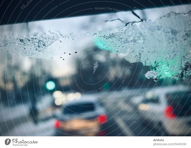 Looking through the cloudy windshield of a car on the road in winter Traffic light Green Winter Transport Street Traffic infrastructure Road traffic Car Town
