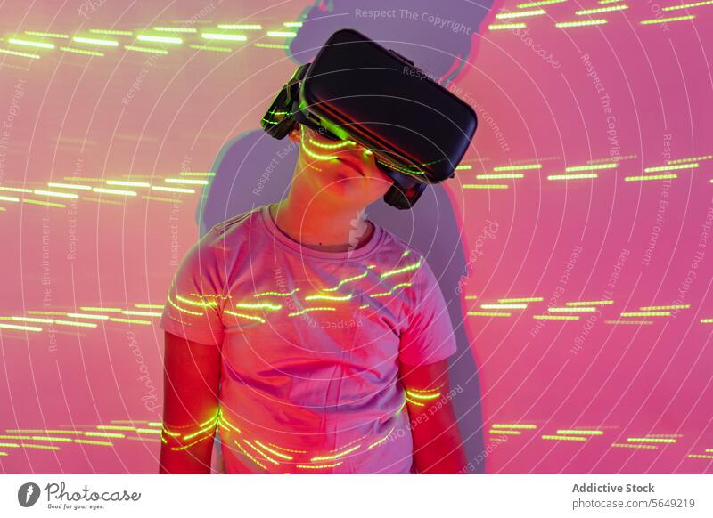 Serious Girl exploring cyberspace in VR goggles in neon lights Virtual Reality Goggles Using Cyberspace Explore Innovation Vision Light Neon Headset Digital