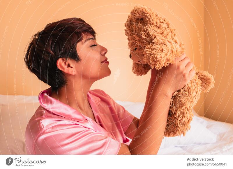 Young woman holding soft teddy bear - a Royalty Free Stock Photo from  Photocase