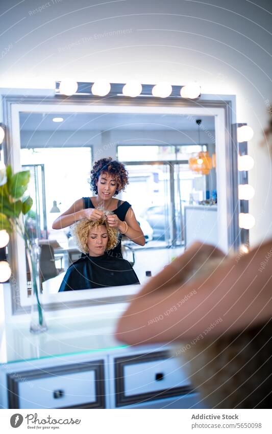 Hairstylist crafting a client's look in salon mirror hairstylist styling curly expertise beauty reflection professional hairdresser cosmetology service fashion