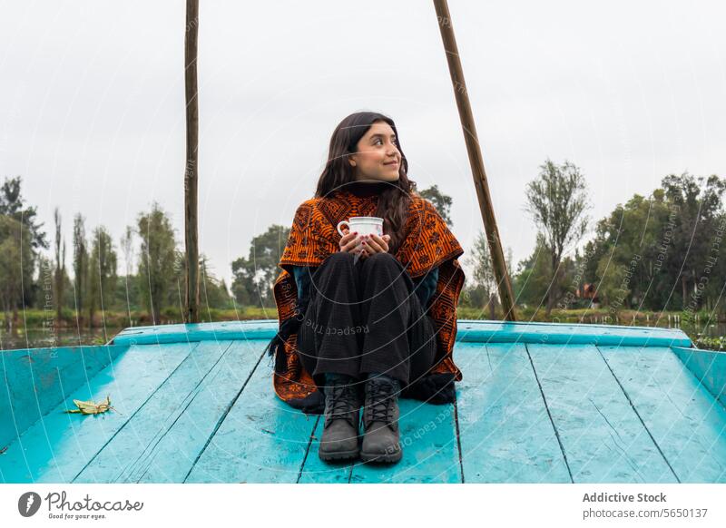 Woman in Serene Trajinera Ride in Xochimilco woman cup trajinera Mexico City reflection calm water greenery conservation Ajolotario Mexican Ajolote endangered