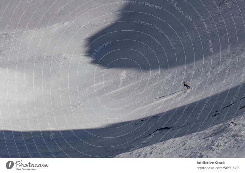 From above of unrecognizable man skiing on snow-capped mountain on sunny day in Zermatt Man Ski Snow Motion Action Stunt Adventure Courage Sport Mountain