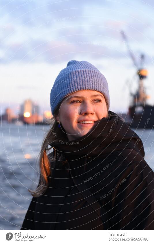 WOMAN - SMILE - HAMBURG - NORDIC Woman 18 - 30 years Young woman Blonde Cap Water Elbe crane Elbe Philharmonic Hall Nordic nordic blue Adults Colour photo