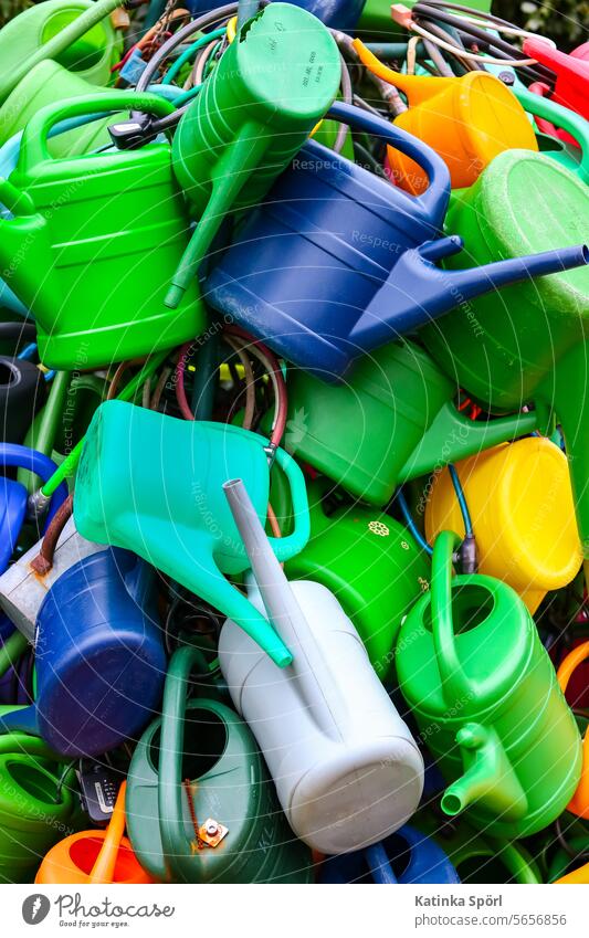 watering cans Watering can Cast Irrigation do gardening Gardening Colour photo soak Gardener Leisure and hobbies plants variegated motley